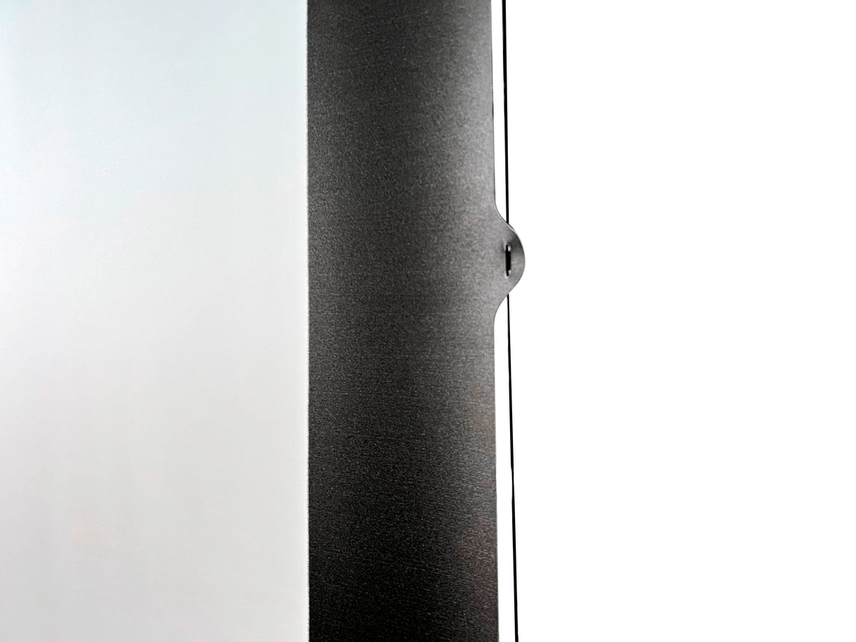 Premium Series tab-tension screen deployed in room